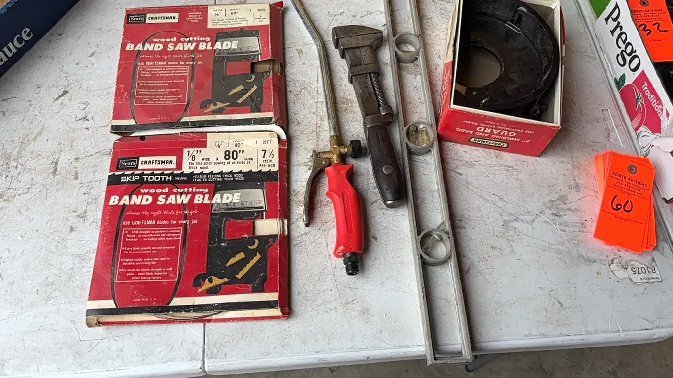 Molding guard, Band saw blades, level, monkey wrench, and blow gun