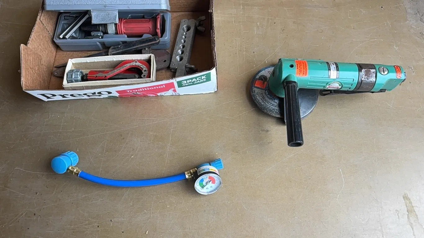 Angle grinder, gauge, impact driver, and misc items