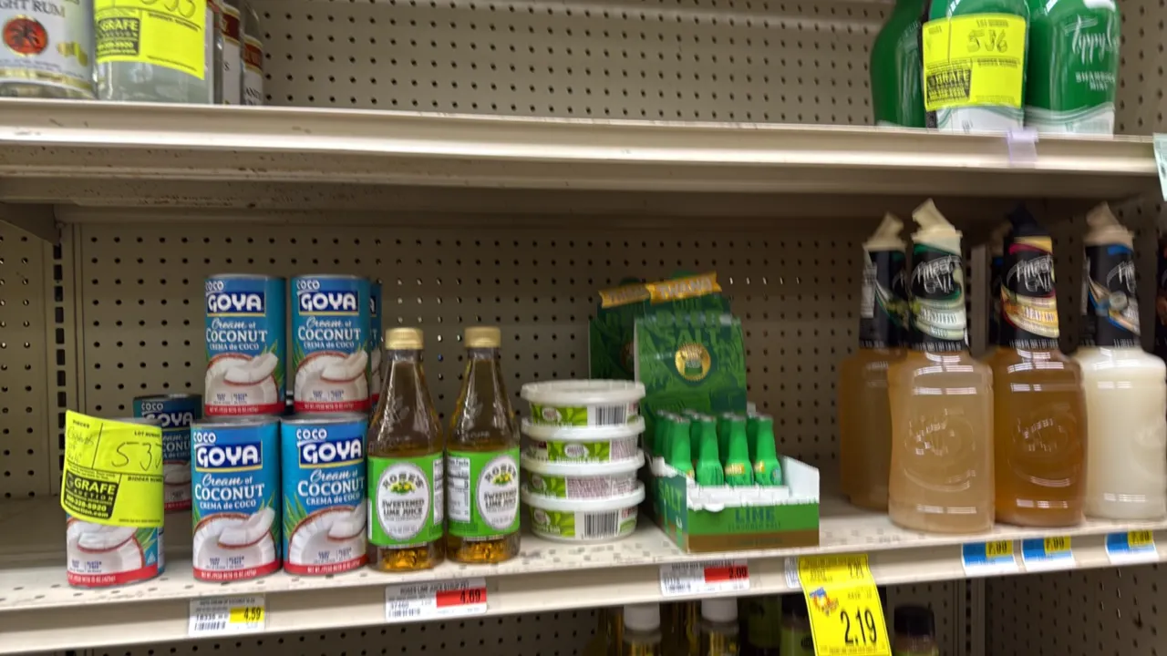 Assorted cocktail mixers, salts, and ingredients inventory. Includes Goya cream of coconut, Rose's sweetened lime juice, Master of Mixes margarita sal