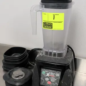Waring Commercial MX1050XTX XTreme commercial blender. Features electronic touchpad controls, clear blending container with lid, and additional contai