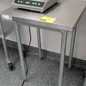 Stainless steel table. Features a flat stainless steel top and galvanized legs with adjustable bullet feet. 24" x 24". Cooktop not included.