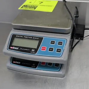 Winco SCAL-D22 digital portion scales. Features 22 lb capacity, stainless steel platform, digital display, and NSF certification. Includes (1) AC powe