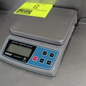 Winco SCAL-D22 digital portion scale. Features a 22 lb capacity, stainless steel weighing platform, digital LCD display, and push-button controls. NSF