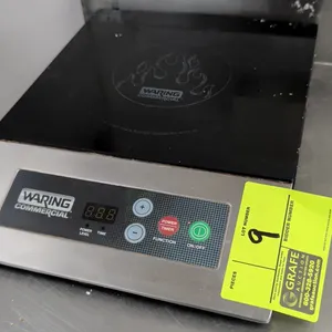 Waring Commercial WIH200 commercial induction range. Features ceramic glass cooktop surface, stainless steel housing, and digital push-button controls