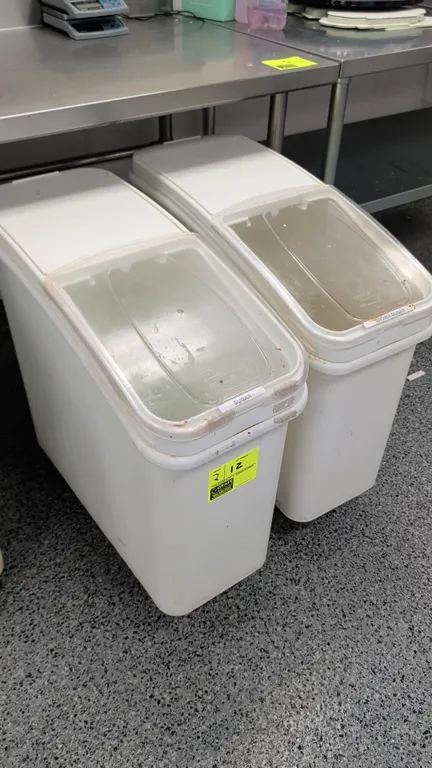 Baker's Mark poly ingredient bins. Features clear sliding lids and white plastic construction. 12"W each. Mounted on casters.