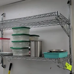 2-tier wire wall-mount shelving unit. Features chrome-plated wire construction, 2 adjustable wire shelves, and wall-mounting posts with brackets. 48"L