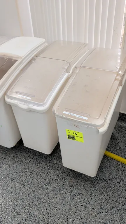 Continental poly ingredient bins. Features white polyethylene construction and clear slide-and-flip lids. 12"W. Mounted on casters.