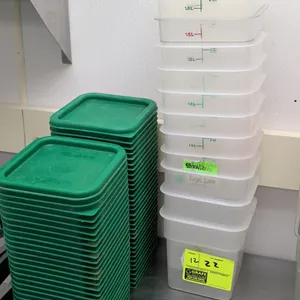 Plastic food storage containers. Features assorted 2-quart and 4-quart capacities with graduated measurement markings. Includes (2) stacks of green pl