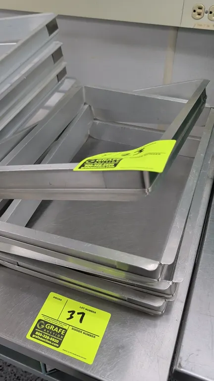 Sheet pan extensions. Features metal construction. 12" x 16".