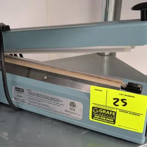 Uline H-293 tabletop impulse bar sealer. Features adjustable timer control knob, indicator light, and integrated slide cutter. Electrical: 120V, 60 Hz