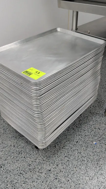 Full-size aluminum sheet pans. Features wire-reinforced rim construction. Includes 4-wheel mobile sheet pan dolly with casters.