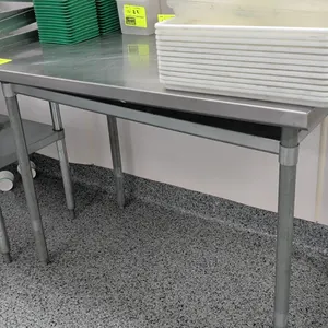 Stainless steel top work table. Features an undershelf and galvanized tubular legs with adjustable bullet feet. 48"L. Contents not included.