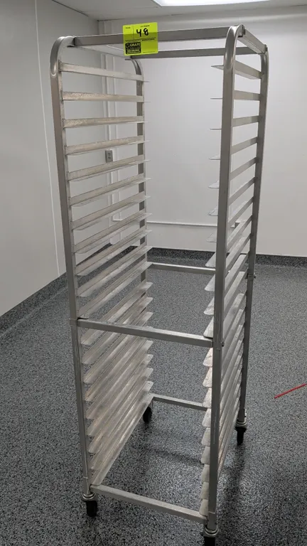 Aluminum 20-tray front load channel sheet pan rack. Designed for 18" x 26" trays. Mounted on swivel casters.