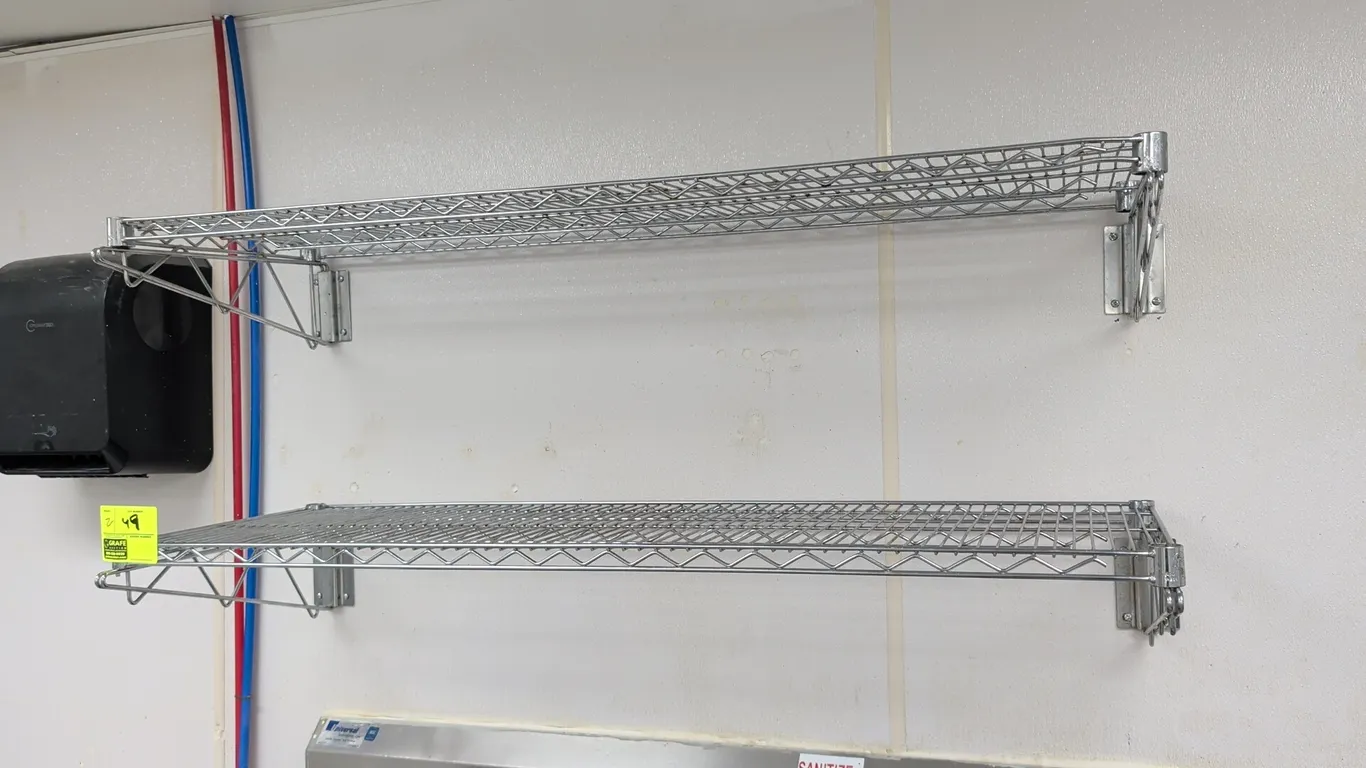 Chrome wire wall-mount shelving. Includes (2) wire shelves with wall mounting brackets. Dimensions: 52" x 18" each.