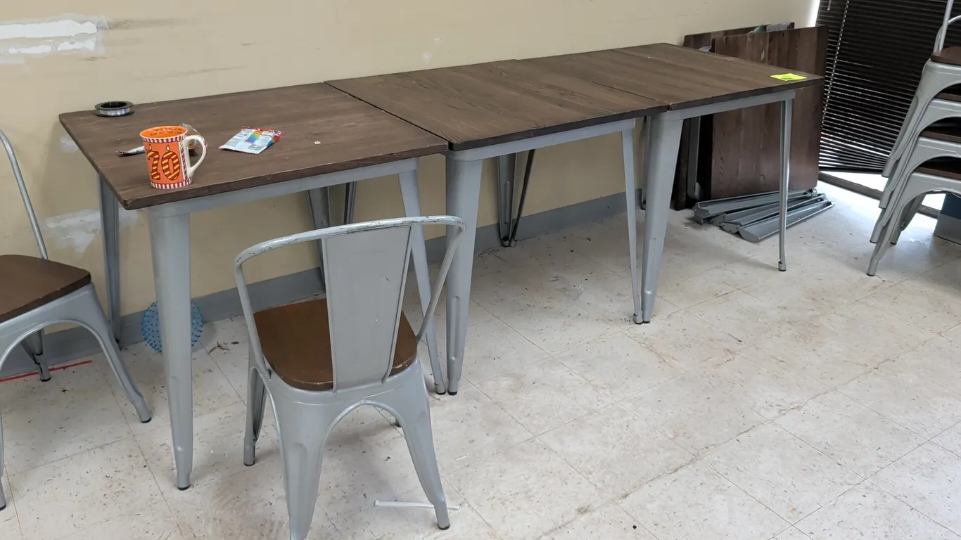 Cafe table and chair sets. Each set includes (1) square table and (2) matching chairs. Features dark wood tops and seats with silver-tone metal frames