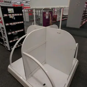 Metal and laminate 4-sided portable merchandise display rack. Features white laminate dividers, metal wire rails, and an overhead sign header. Dimensi