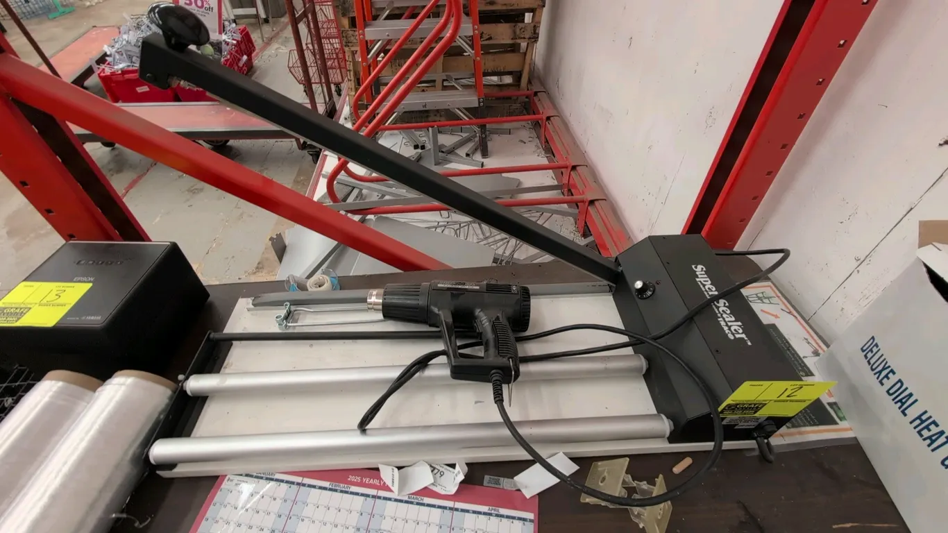 Traco Super-Sealer SS-24DS portable shrink wrap system. Includes Hotshot NEG-1A electric heat gun, dual roller film dispenser cradle, and sealing arm