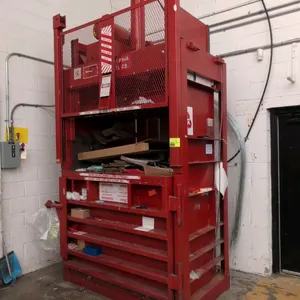 1996 Philadelphia Tramrail Company 3400HDRH vertical baler. Features a left swing door, safety cage gate, side control station, and included bundle of