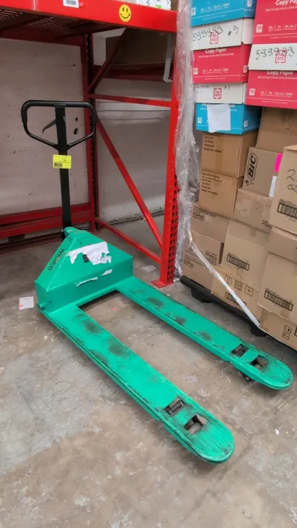 Wesco manual pallet jack. Features steel construction with green finish, 4,400 lb capacity, and loop handle with fingertip release lever. Fork dimensi