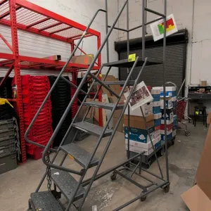 Tri-Arc steel warehouse stock ladder. Features perforated slip-resistant steps, top platform, and safety handrails. 450 lb weight capacity. 72" platfo