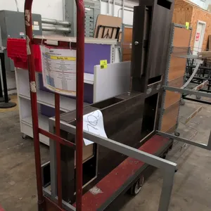 Metal 6-wheel U-boat stocking cart. Features red platform deck and tubular steel end handles. 5'L. Mounted on 6 wheels. Contents not included.