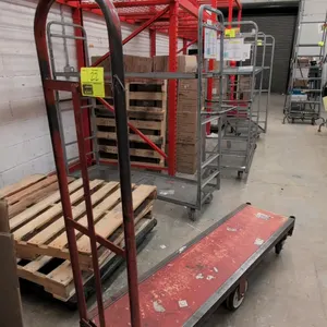 Metal 6-wheel U-boat stocking cart. Features a solid platform deck and a single removable tubular steel end handle. 5'L. Mounted on 6 wheels with cent