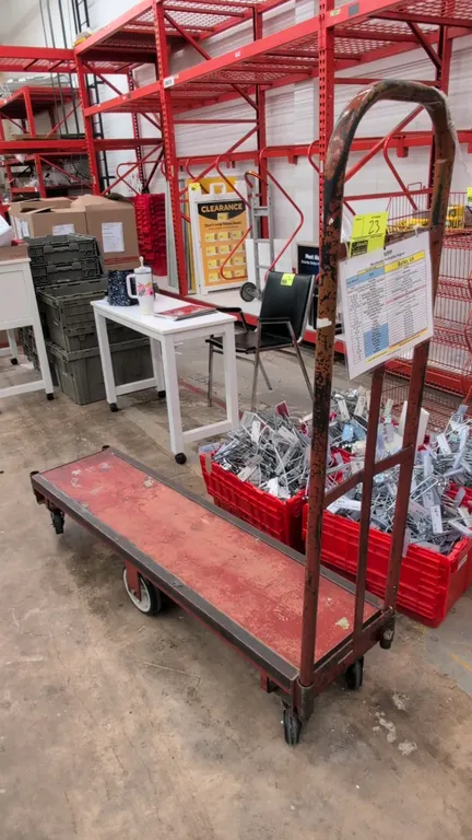 Metal 6-wheel U-boat stocking cart. Features steel frame platform with a tall end handle. 5'L. Mounted on 6 casters with center rigid wheels and corne