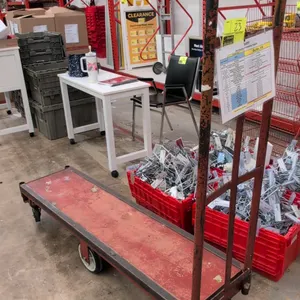 Metal 6-wheel U-boat stocking cart. Features steel frame platform with a tall end handle. 5'L. Mounted on 6 casters with center rigid wheels and corne