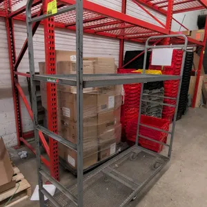 Metal 2-tier U-boat utility cart. Features expanded metal decks and dual tubular steel end handles. 5'L. Mounted on 6 wheels.