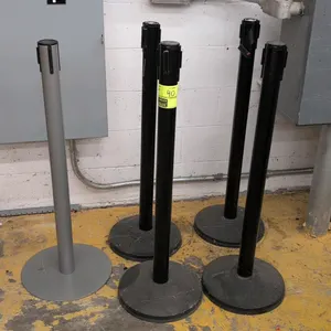 Assorted retractable belt crowd control stanchions. Features metal posts with weighted circular bases and multi-directional belt receivers. Includes b