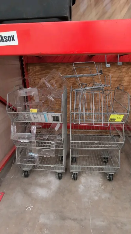 Metal 3-tier wire merchandise display racks. Features multi-tier wire basket construction. Includes wire and plastic dividers. 18" x 36"H. Mounted on