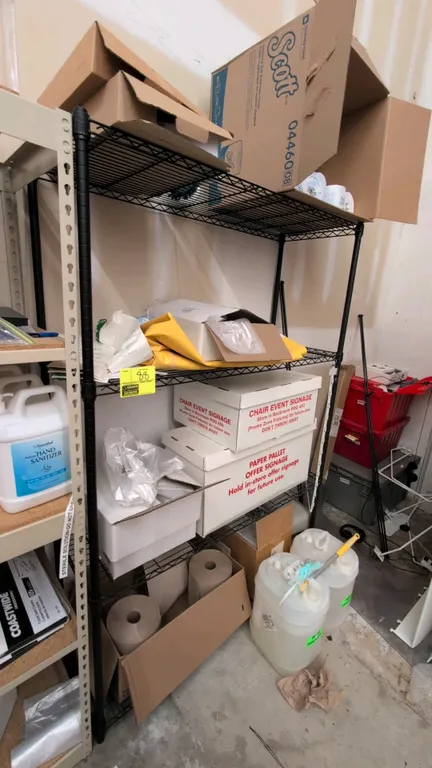 Metal 4-tier wire shelving rack. Features a black finish and wire grid shelves. 4'L x 1.5'W x 6'H. Contents not included.