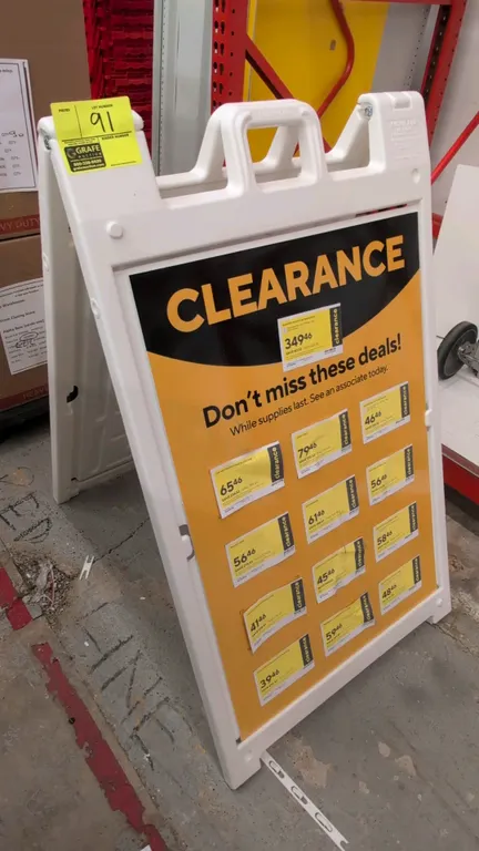Plasticade Signicade Deluxe polyethylene A-frame sign stand. Features white molded plastic construction, integrated carry handle, and folding design.