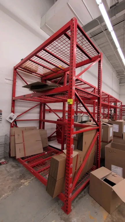 8'L section of Madix teardrop pallet racking. Features 3.5" crossbars and wire mesh decking. Red finish. Dimensions: 8'L x 4'W x 10'H. Beam capacity: