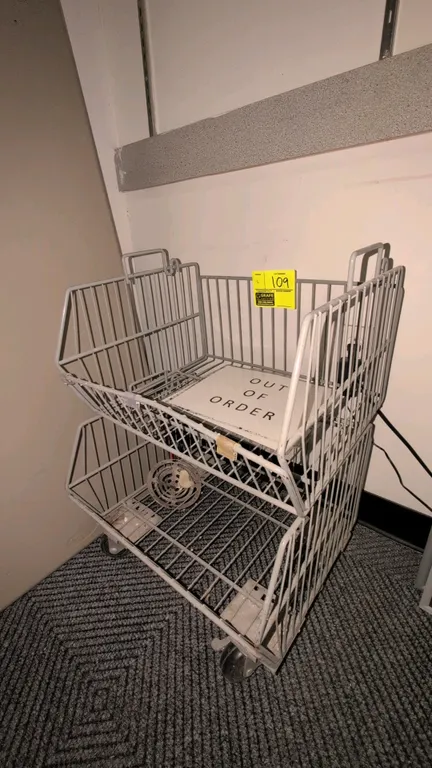 18" Metal wire stacking display baskets. Features open-front wire dump bin design. Bottom unit mounted on swivel casters. Contents not included.