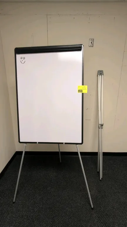 Quartet adjustable metal presentation easel tripods. Includes 30" x 42" dry erase whiteboard with top flip chart clamp.