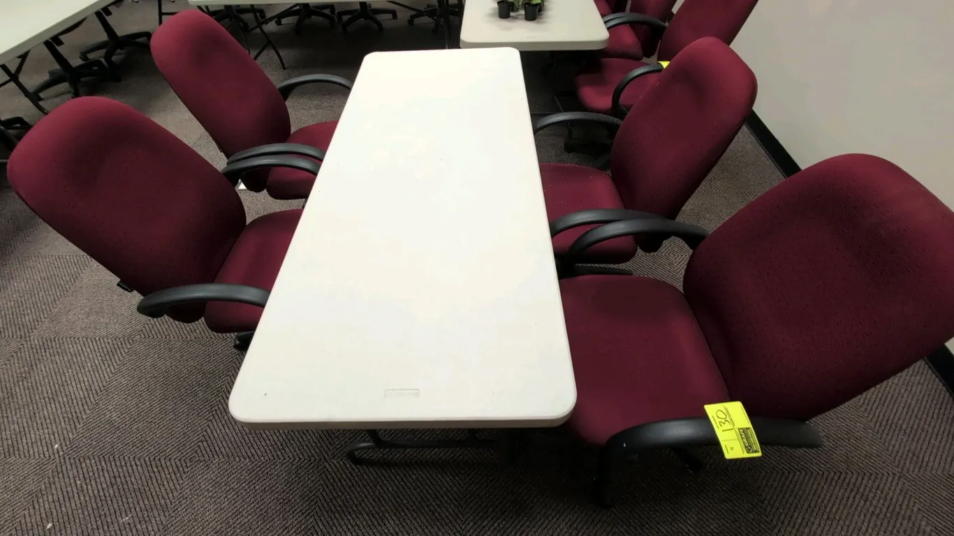 Corporate Express cushioned office chairs. Features burgundy patterned fabric upholstery, fixed armrests, and pneumatic seat height adjustment. Mounte