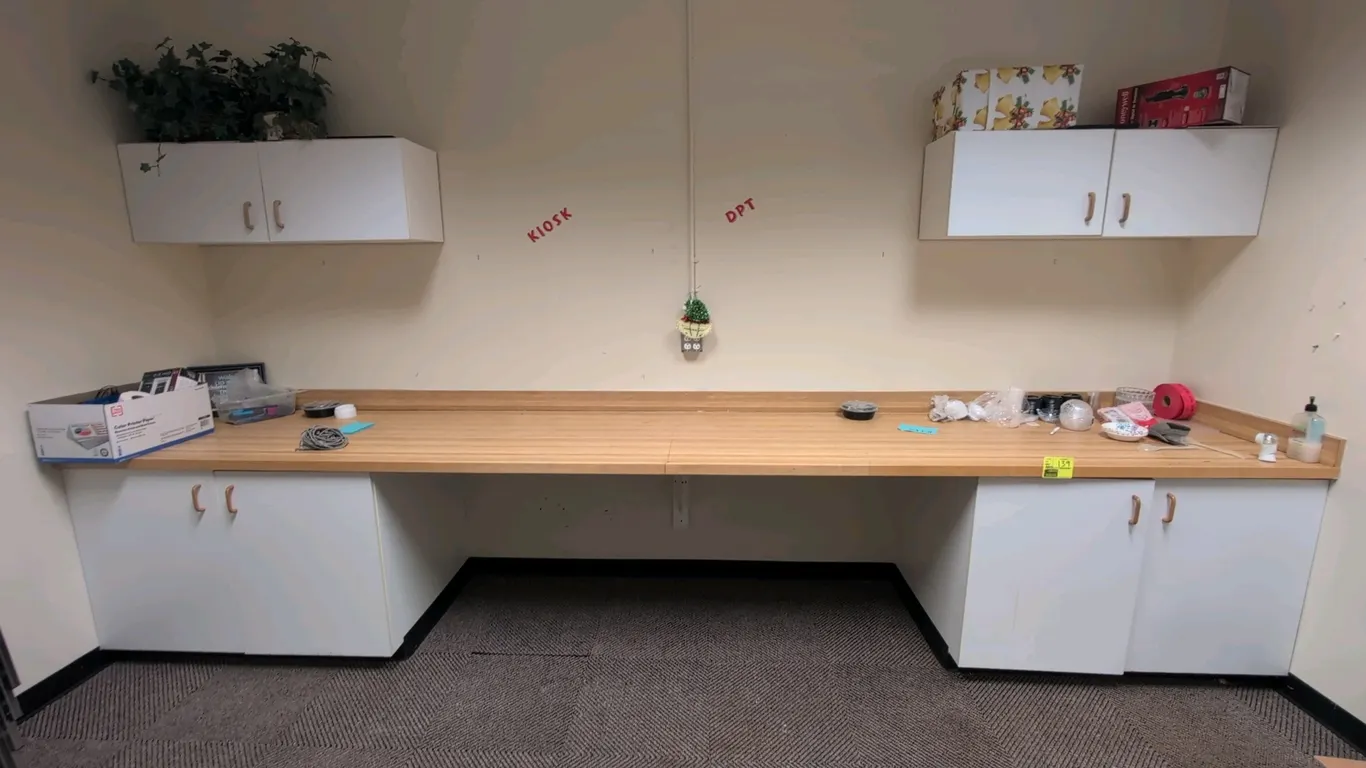 Laminate countertop with upper and lower cabinets. Features a butcher block style laminate countertop with integrated backsplash, (2) 2-door base stor