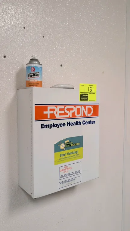 Respond metal first aid cabinet. Features 3 interior shelves, inner door organizer pouches, and top carry handle. Includes assorted first aid contents