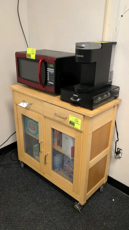 Wood portable utility cabinet. Features (2) upper drawers, (2) lower cabinet doors with glass inserts, and (1) interior shelf. 3'W. Mounted on swivel