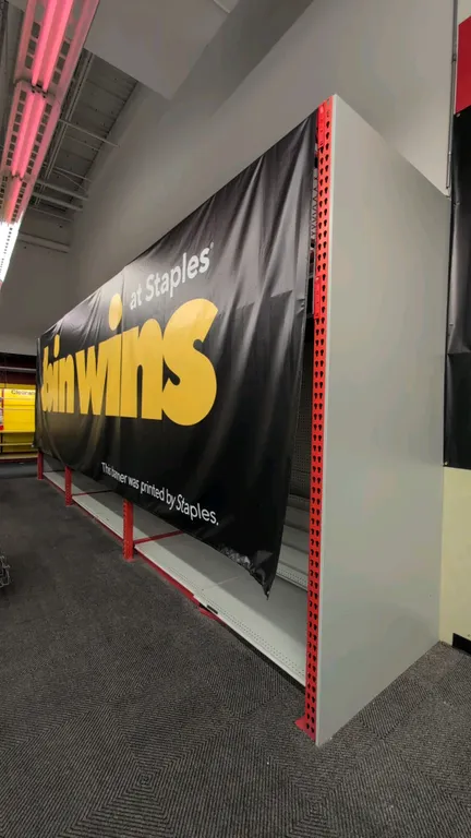 Madix teardrop pallet racking sections. Features 3" crossbars, wire decking, integrated lighting, pegboard backing, base shelves, and printed banner c