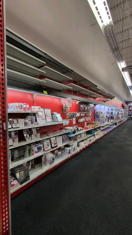 80'L of Madix wall shelving. Features 36'L of overhead canopy lighting and roller curtains, 120"H uprights, and 24"D base shelves. Includes multi-tier
