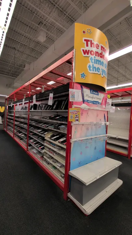 60'L of Madix gondola shelving. Features 18"/18" base shelves, 108"H uprights, overspan racking with wire decking, and integrated canopy lighting. Con