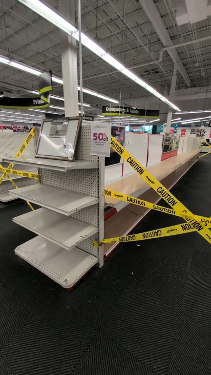 80'L of Madix gondola shelving. Features double-sided sections with 18"/18" base shelves, 60"H uprights, pegboard and solid backing, and display shelv