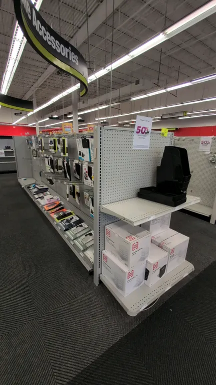 38'L of Madix gondola shelving. Features 60"H uprights, 18"/18" base decks, and pegboard backing. Contents not included. Note: Gondola shelving is mea