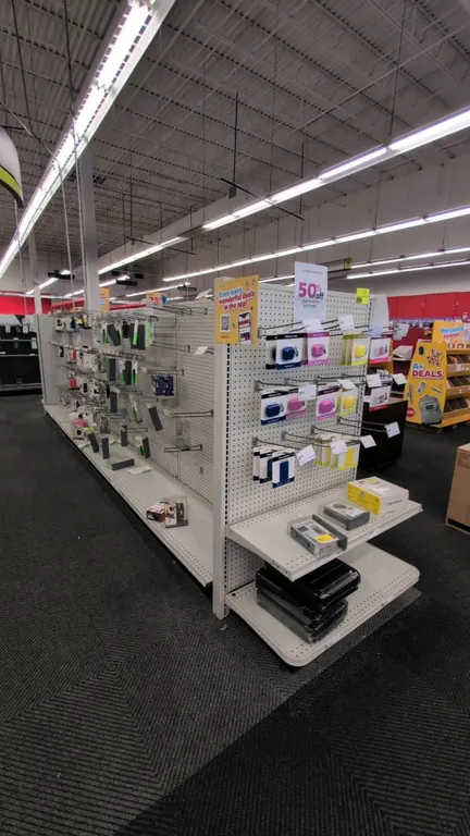 38'L of Madix gondola shelving. Features 60"H uprights with 18"/18" base shelves and pegboard backing. Contents not included. Note: Gondola shelving i