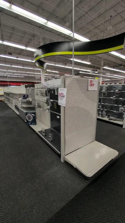70'L of Madix gondola shelving. 60"H uprights with 22" and 18" base shelves. Features pegboard backing. Contents not included. Note: Gondola shelving