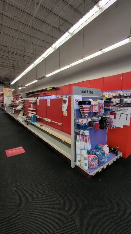 88'L of Madix gondola shelving. 60"H uprights with 22"D base shelves. Features pegboard and smooth backing panels, adjustable metal shelves, and displ