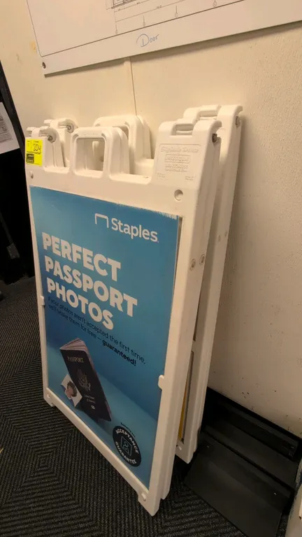 Plasticade Signicade Deluxe poly A-frame sign stands. Features molded white plastic folding construction with integrated top carry handle and slide-in