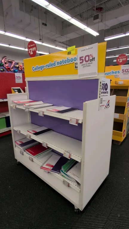 51" metal portable 2-sided merchandise display rack. Features multi-tier adjustable metal shelving on both sides, purple back panel, and top header bo